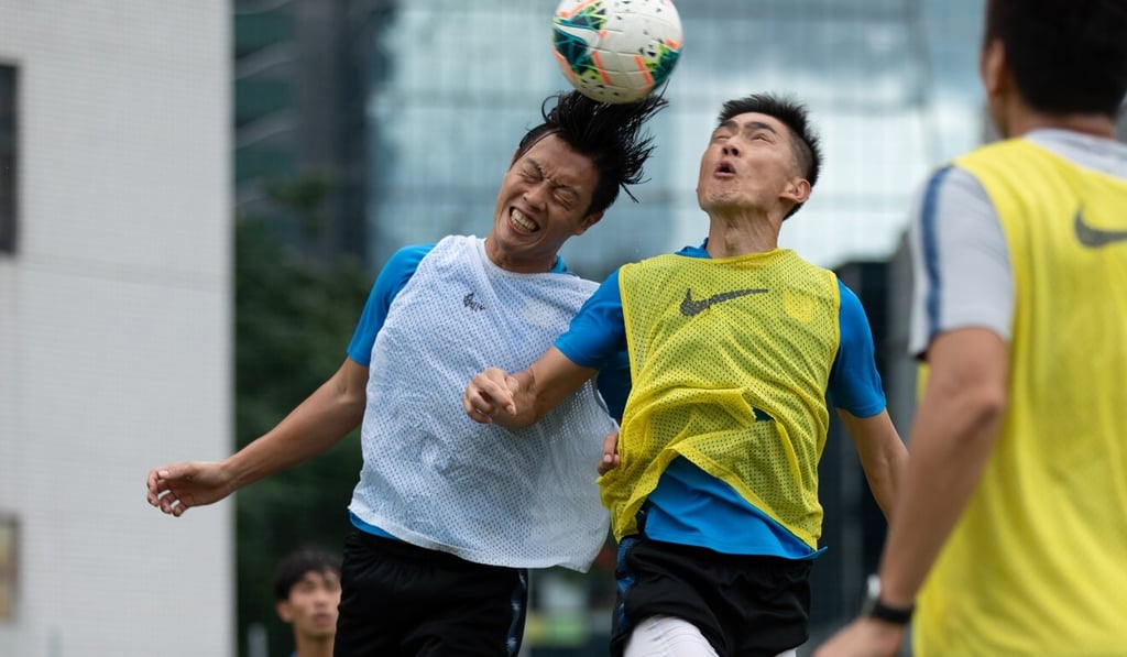 Kitchee players prepare for the reopening of the season, with captain Huang Yang (right) and defender Tong Kin-man fighting for the ball. Photo: Handout Kitchee players prepare for the reopening of the season, with captain Huang Yang (right) and defender Tong Kin-man fighting for the ball. Photo: Handout