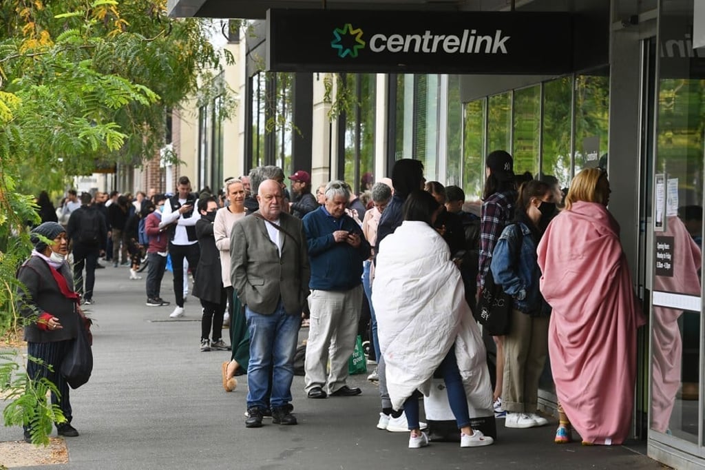 Hundreds of people queue outside an Australian government welfare centre, Centrelink, in Melbourne on March 23. Photo: Agence France-Presse