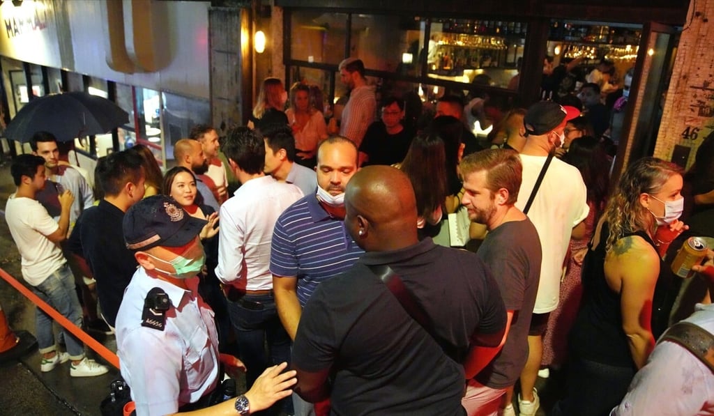 Police carry out checks at bars in Central after they resumed operation on Friday. Photo: Winson Wong