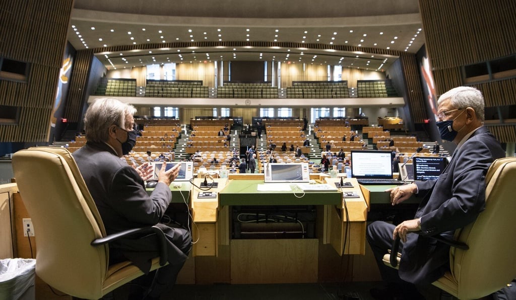UN Secretary General Antonio Guterres talks with Volkan Bozkir, president of the 75th session of the United Nations General Assembly, before the 75th anniversary meeting in New York on Monday. Photo: UN handout via Xinhua