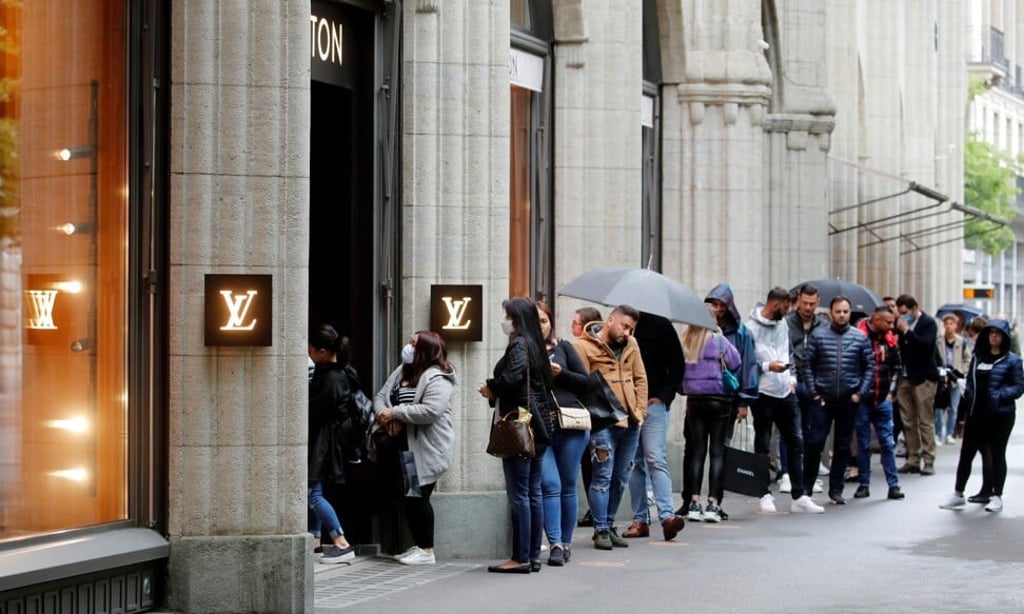 People queuing in front of a Louis Vuitton store on reopening day in Zurich as Switzerland eases lockdown measures during the Covid-19 outbreak. Photo: Reuters