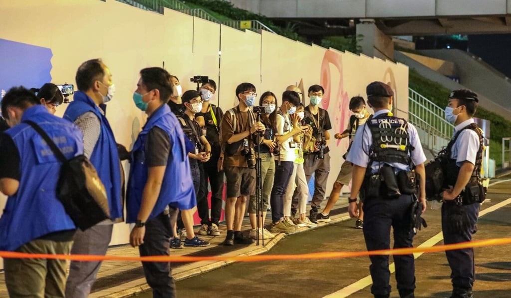 Police stop and search journalists outside the Hong Kong Design Institute in September. Photo: May Tse Police stop and search journalists outside the Hong Kong Design Institute in September. Photo: May Tse