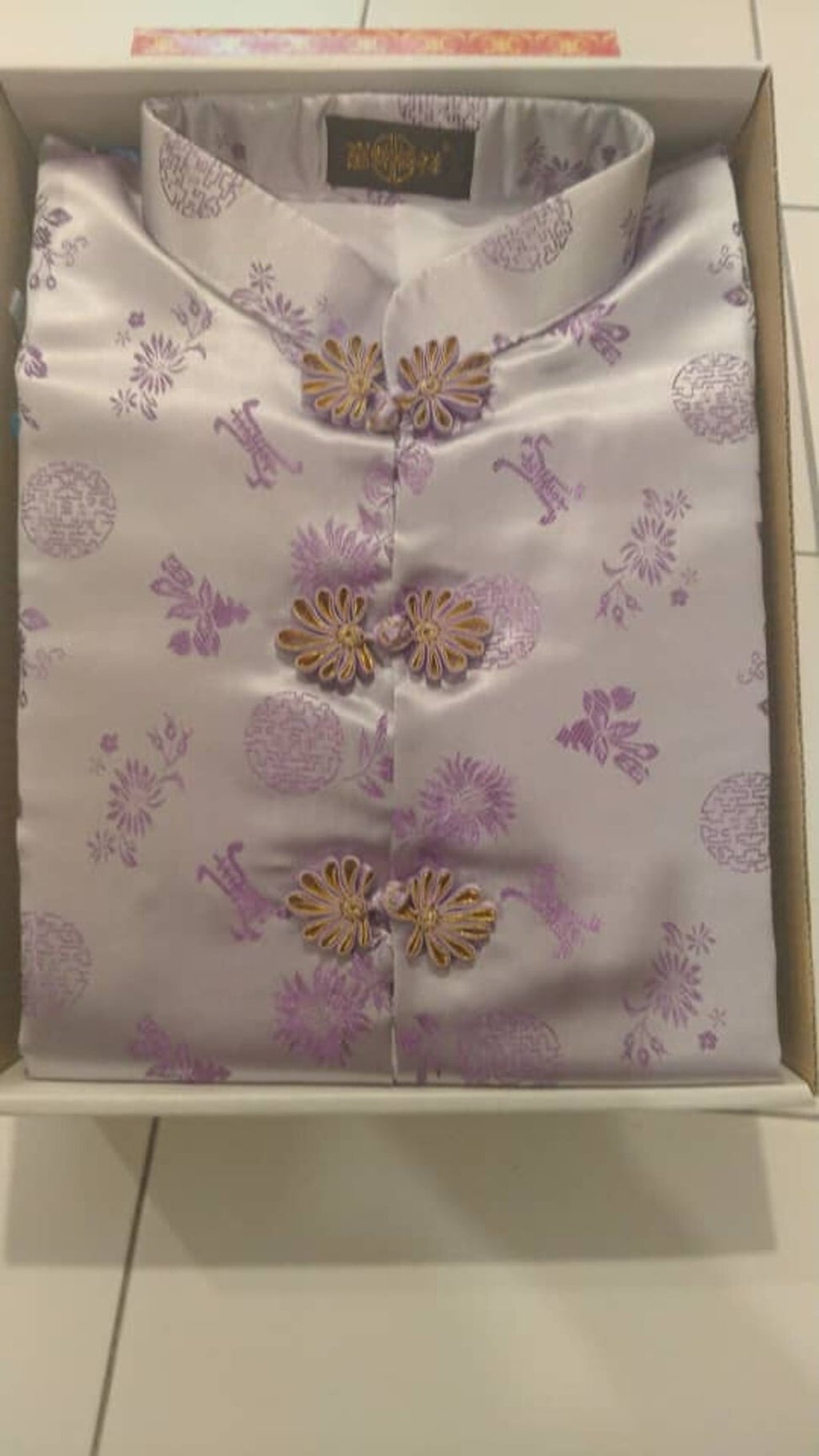 Chinese-style funeral attire for a deceased woman in Malaysia.