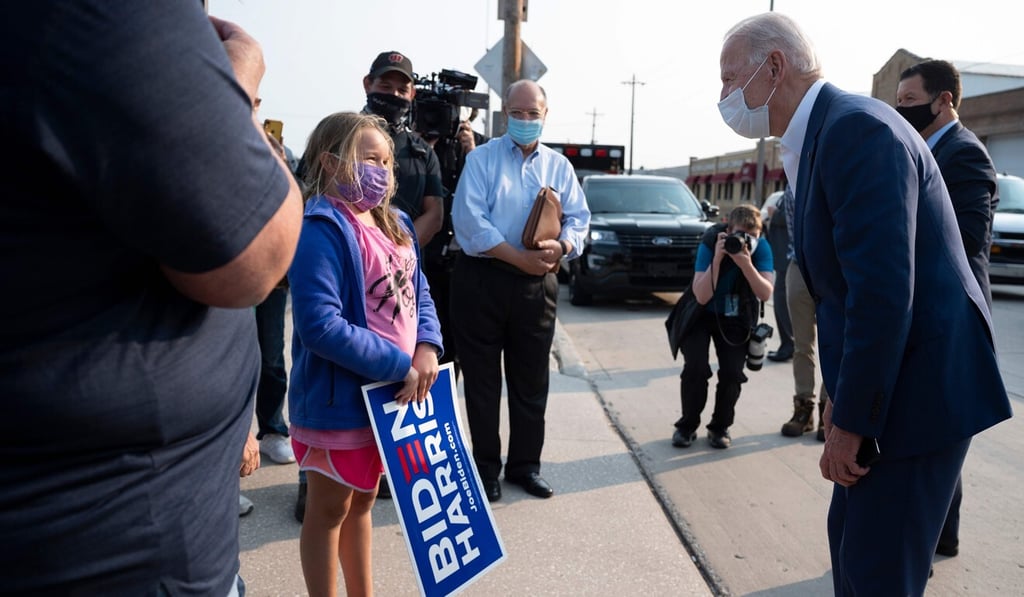 Democratic presidential candidate Joe Biden speaks with supporters at an aluminium manufacturing facility in Manitowoc, Wisconsin, on Monday. Photo: AFP