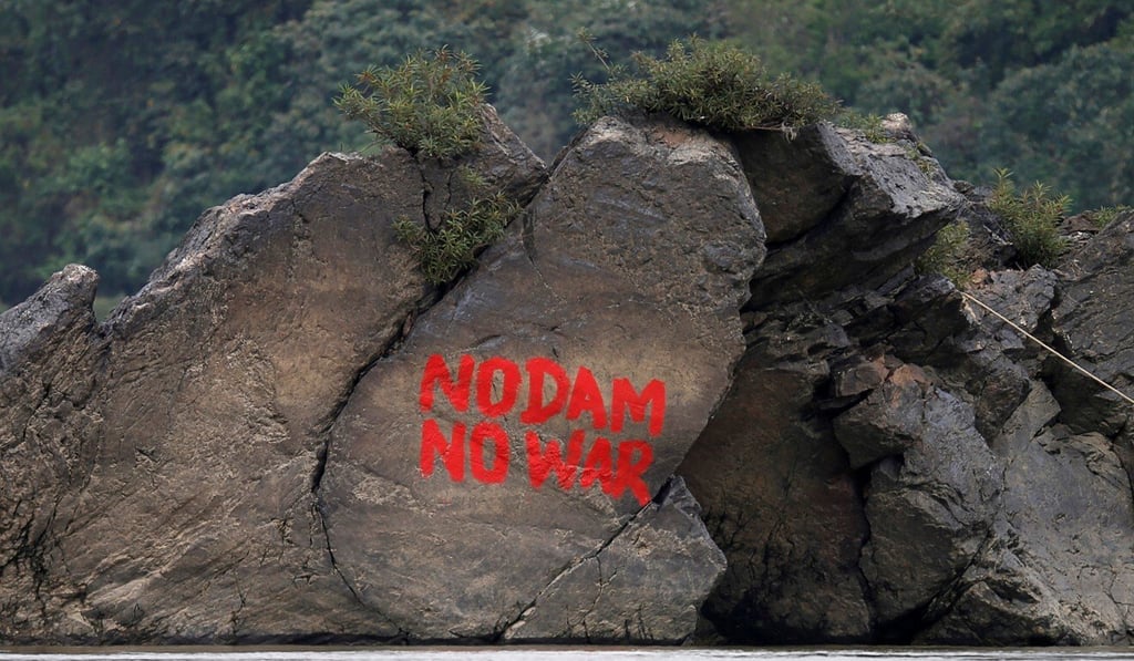 Graffiti referring to the China-backed Myitsone Dam on a rock in Kachin state, Myanmar. Photo: Reuters Graffiti referring to the China-backed Myitsone Dam on a rock in Kachin state, Myanmar. Photo: Reuters