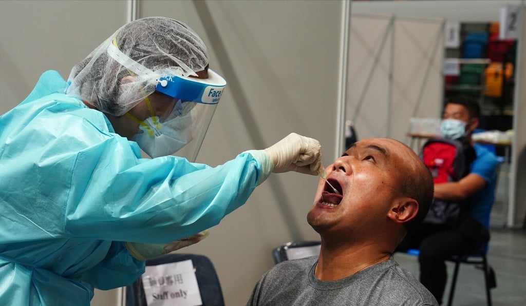 Hong Kong now favours deep-throat saliva testing for its reliability, but it takes about eight hours to get the results. Photo: Sam Tsang Hong Kong now favours deep-throat saliva testing for its reliability, but it takes about eight hours to get the results. Photo: Sam Tsang