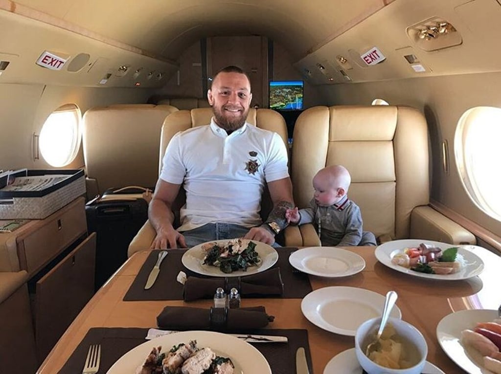 Flying in style with his son. Photo: @thenotoriousmma/Instagram