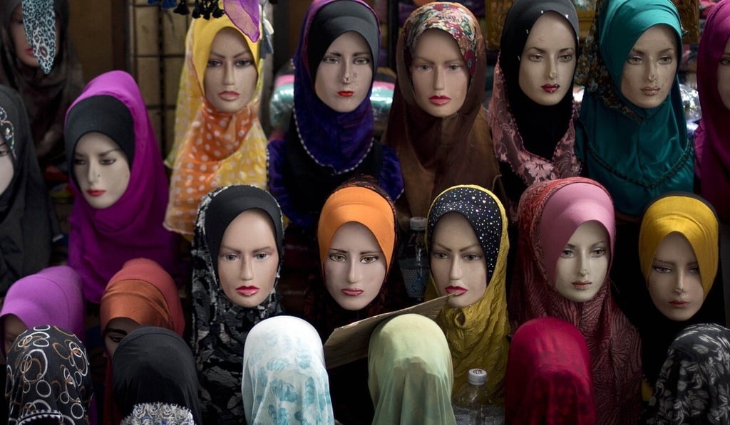Mannequins with headscarves on display outside a shop in downtown Kuala Lumpur. Photo: AFP