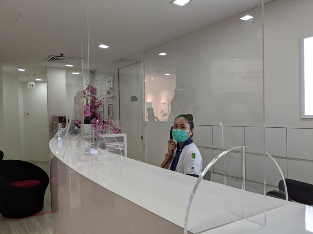 Screens and dividers at placed at the reception of the DRx Clinic in Singapore as demand for beauty treatments pick up.