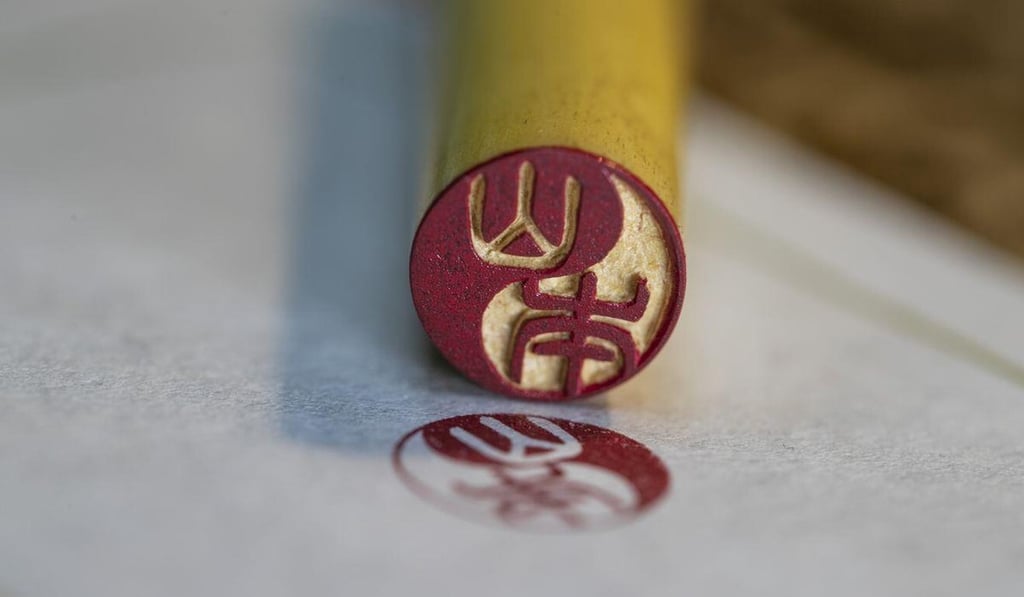 A 'hanko' personal seal is seen after being used to stamp a document in Japan. Photo: Twitter