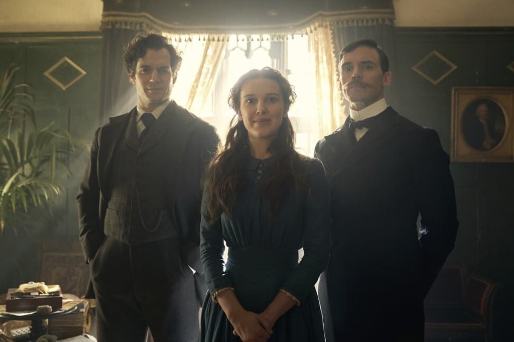 Henry Cavill (left), Millie Bobby Brown and Sam Claflin star in Enola Holmes. Photo: Netflix via AP Henry Cavill (left), Millie Bobby Brown and Sam Claflin star in Enola Holmes. Photo: Netflix via AP