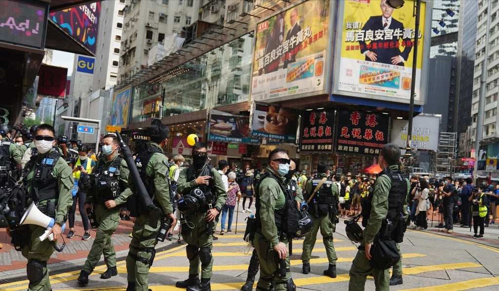 Riot police officers wait in Causeway Bay as anti-government protesters gather in the area. Photo: Sam Tsang