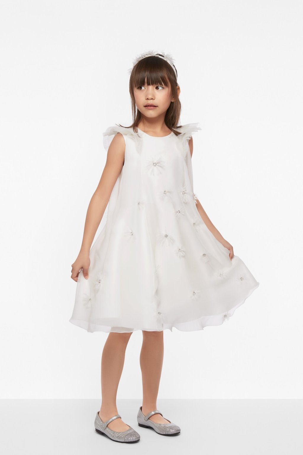 A Dior fairy tale silk organza and muslin dress embroidered with feathers and pearls, priced at US$10,700. The glitter lambskin ballet flats are US$516. Photo: Dior A Dior fairy tale silk organza and muslin dress embroidered with feathers and pearls, priced at US$10,700. The glitter lambskin ballet flats are US$516. Photo: Dior