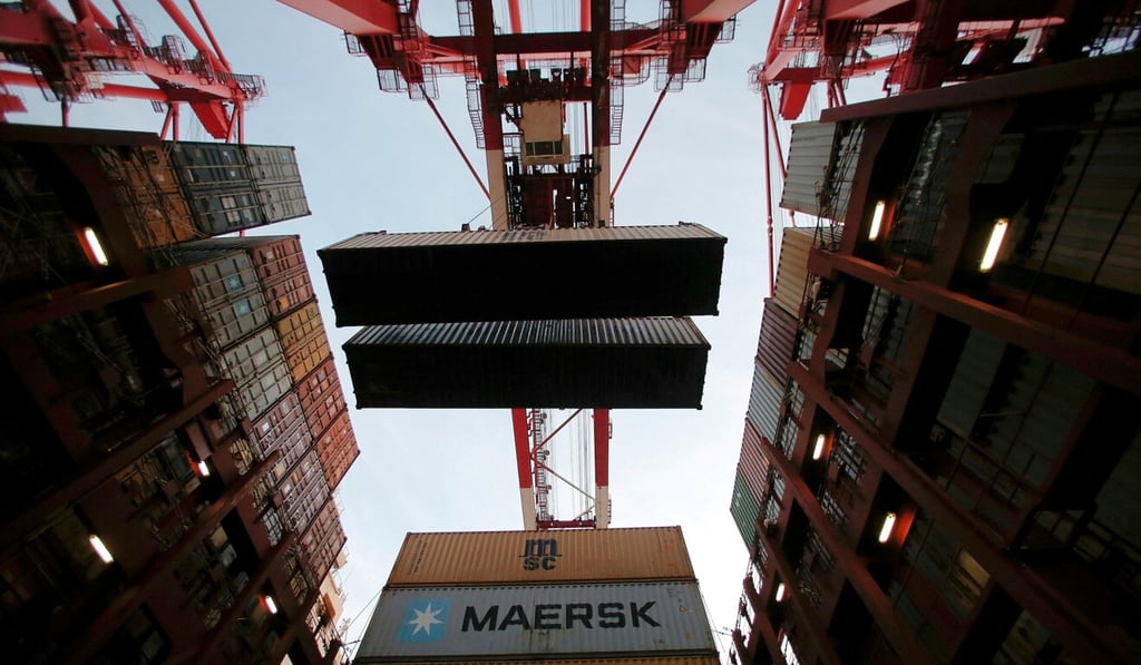 Containers are unloaded at a port in Shanghai. The customs authority is investigating a complaint that a foreign company was given access to detailed import and export data that could give it an advantage over local suppliers. Photo: Reuters