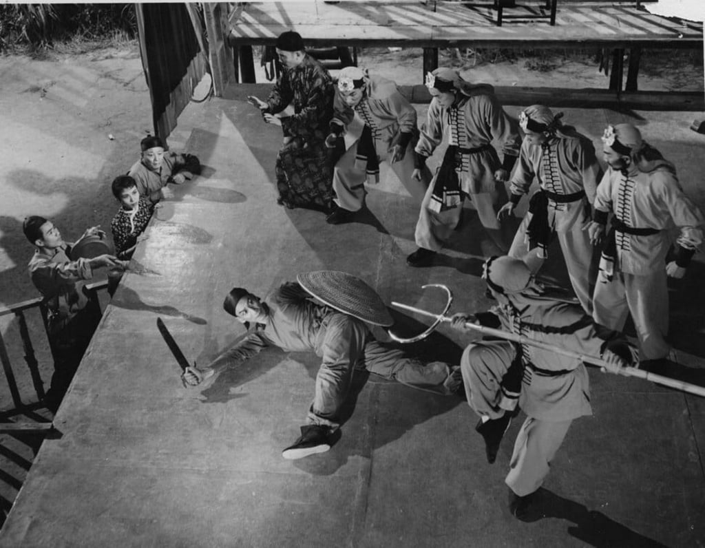 Kwan Tak-hing (left) in a still from Wong Fei-Hung's Battle with the Five Tigers in the Boxing Ring (1958).