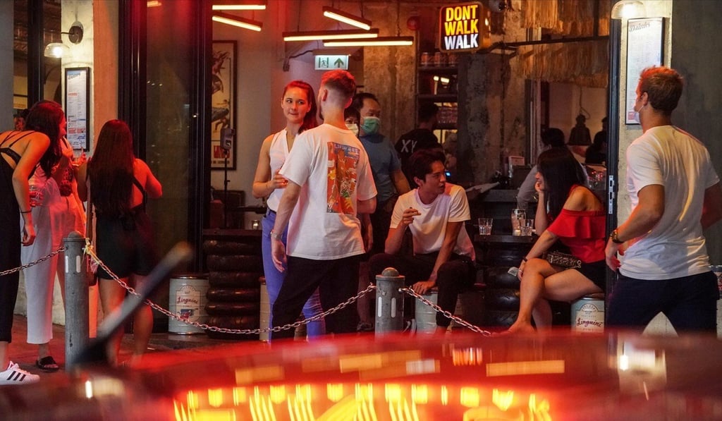 People enjoy the long weekend at a bar in Soho, Central. Photo: Felix Wong People enjoy the long weekend at a bar in Soho, Central. Photo: Felix Wong