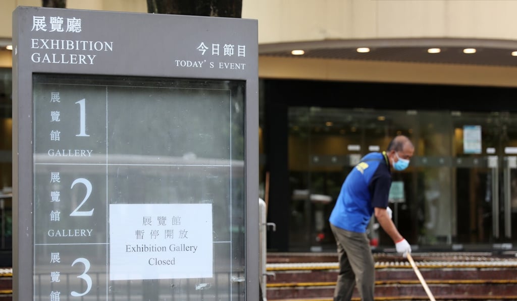 Cleaners disinfecting outside the Hong Kong Central Library in Causeway Bay. Photo: SCMP / Nora Tam