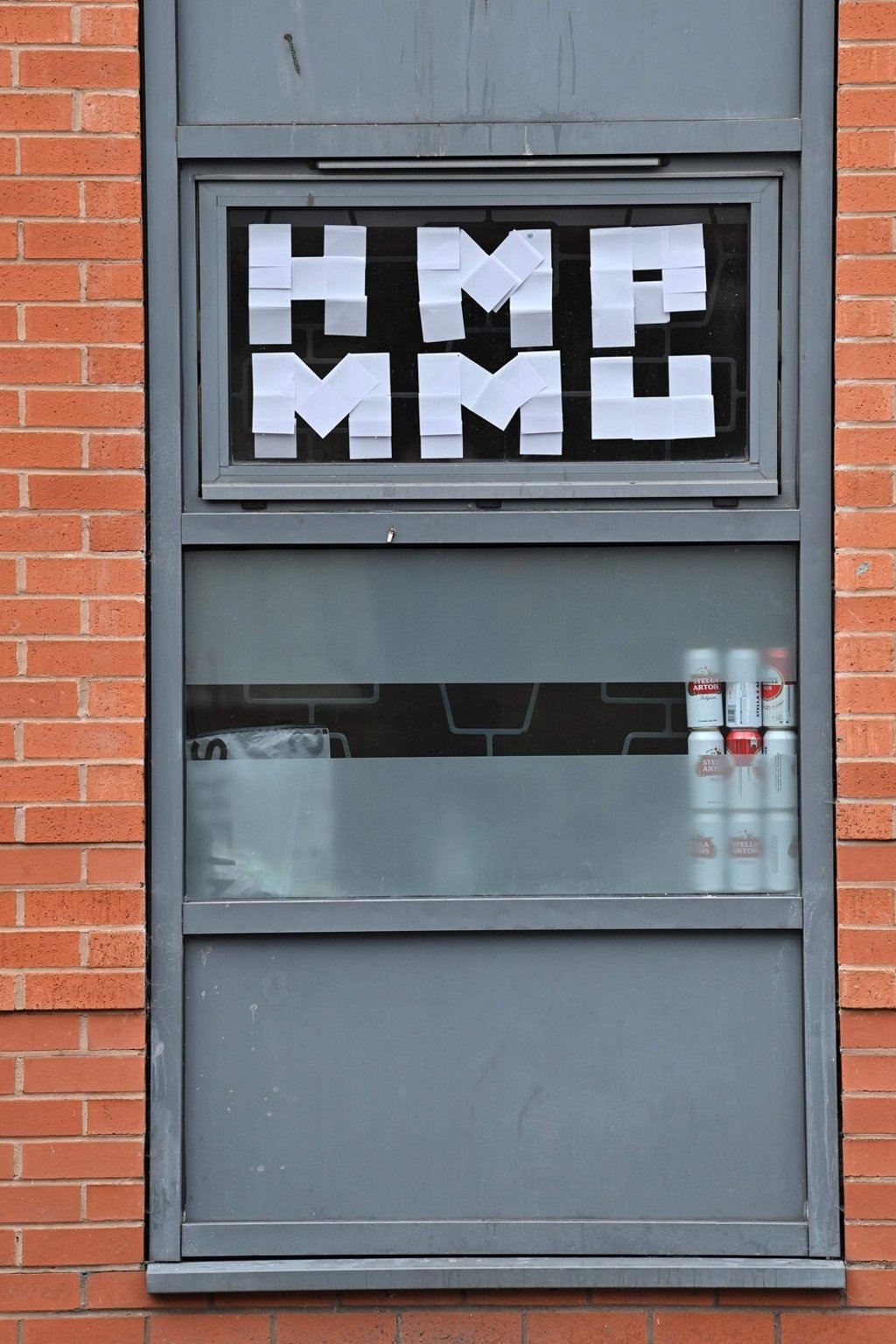 A sign in the window of Birley Halls at Manchester Metropolitan University, where students have been forced to self-isolate following a surge in Covid-19 cases. Photo: AP