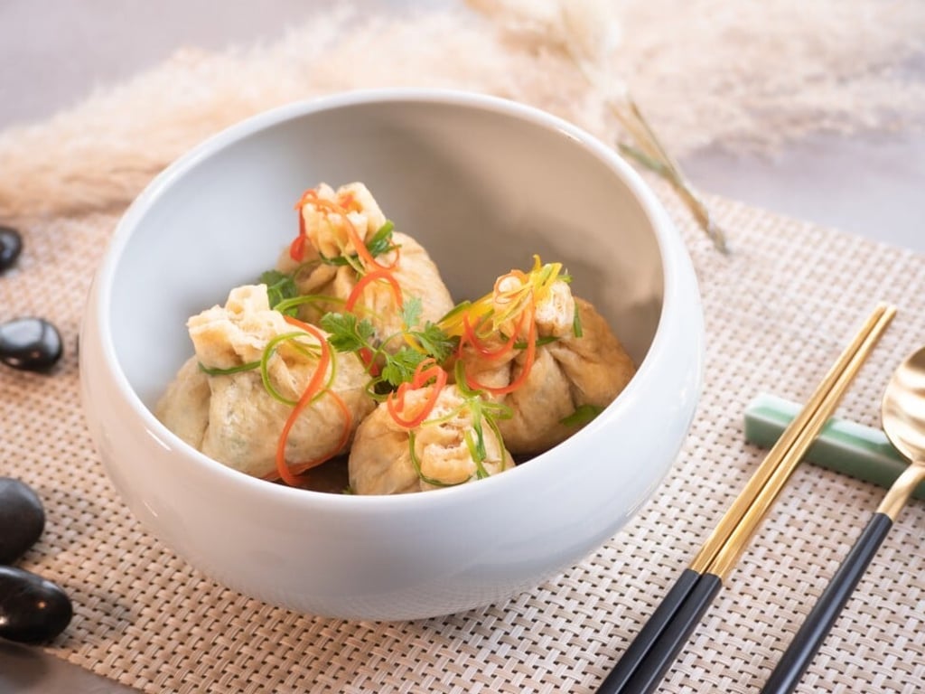 Dishes served at Soil to Soul include blessed tofu skin pockets stuffed with sweet potato noodles. Photo: Soil to Soul Dishes served at Soil to Soul include blessed tofu skin pockets stuffed with sweet potato noodles. Photo: Soil to Soul