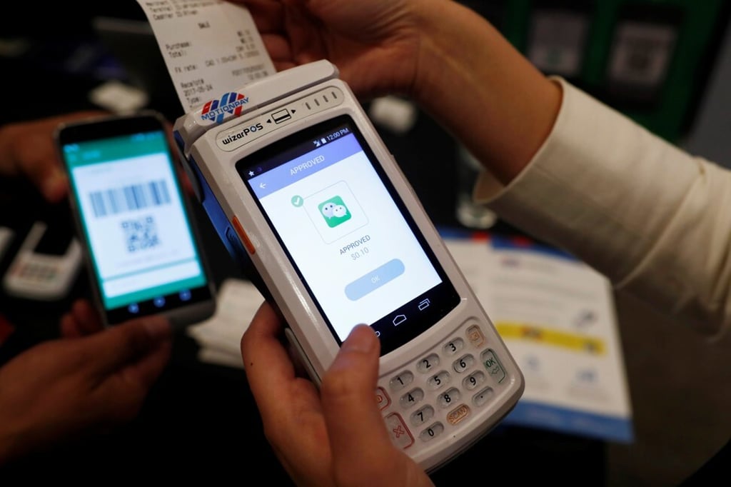 A demonstration of the high security digital payment unit built by Motion Pay, that allows customers to pay in Chinese yuan using WeChat Pay, and Alipay, in Toronto on May 24, 2017. Photo: Reuters
