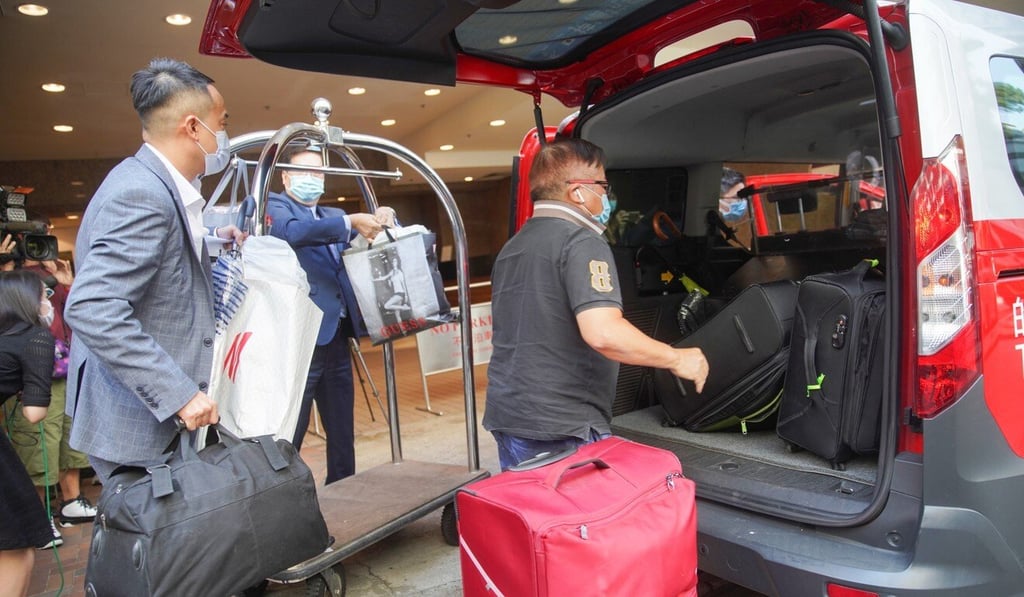 Guest leave The Royal Garden in Tsim Sha Tsui after it was ordered to close for two weeks. Photo: Winson Wong