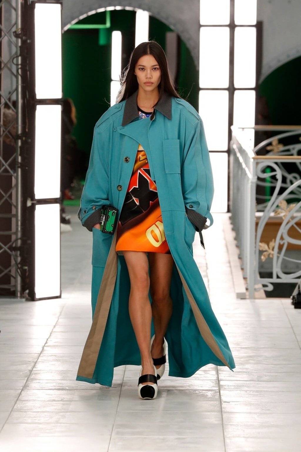 An oversized coat and clog-like heels feature in a striking look in Louis Vuitton’s spring/summer 2021 show. Photo: Xinhua An oversized coat and clog-like heels feature in a striking look in Louis Vuitton’s spring/summer 2021 show. Photo: Xinhua
