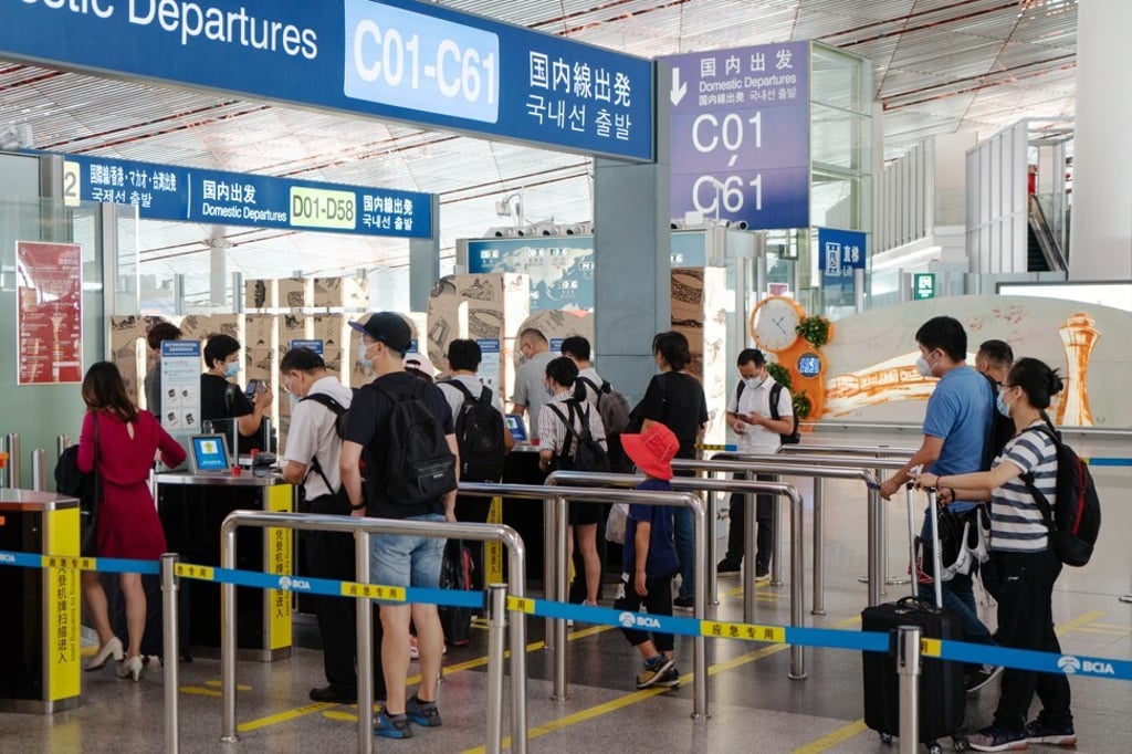 Travellers making their way to the domestic departures area at Beijing Capital International Airport on Tuesday, August 25, 2020. Photo: Bloomberg