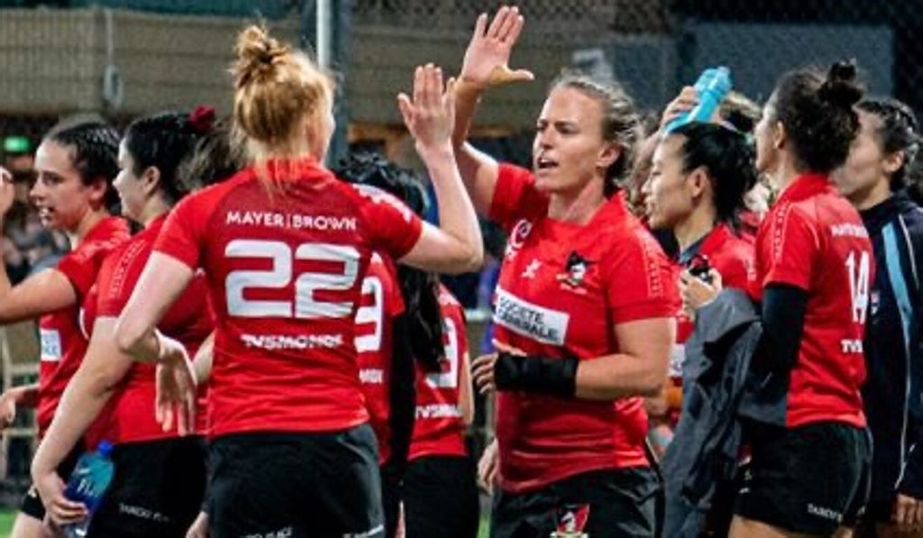 Suzanne Sittko high-fives her Valley Black teammates after another win.