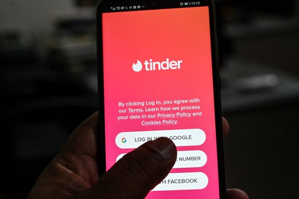 A user checks the Tinder dating app in Islamabad. Photo: AFP A user checks the Tinder dating app in Islamabad. Photo: AFP