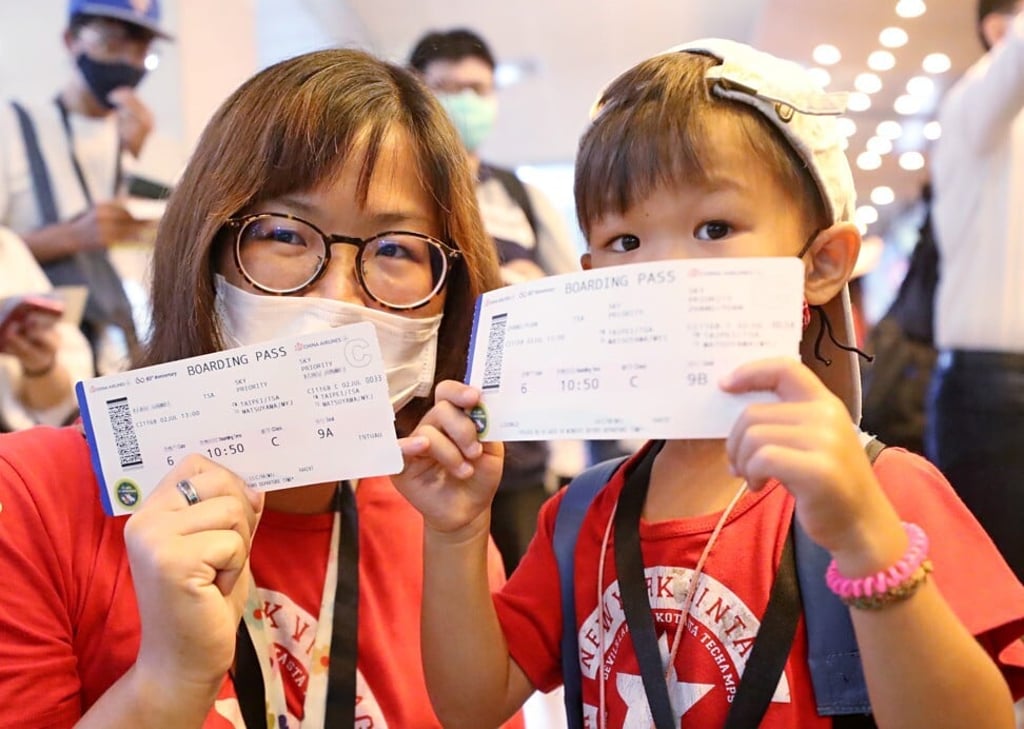 Two passengers on a “flight to nowhere” from Taipei’s Songshan Airport. Photo: CNA
