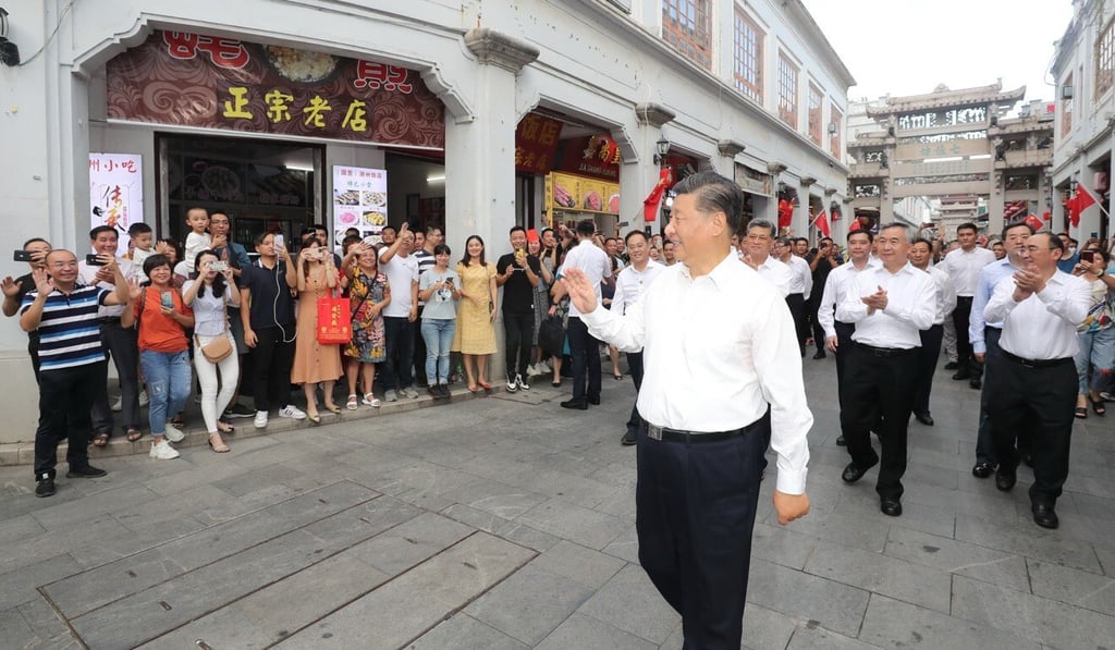 Xi Jinping waves to onlookers during his visit to Chaozhou on Monday. Photo: Xinhua Xi Jinping waves to onlookers during his visit to Chaozhou on Monday. Photo: Xinhua
