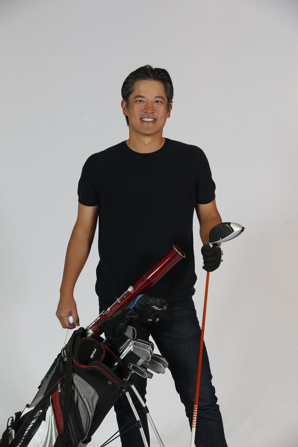His bassoon tucked into his golf bag, Vance Lee is ready for a round - and a post-golf meal. LIke orchestral playing, it always makes him hungry, he says. Photo: courtesy Vance Lee
