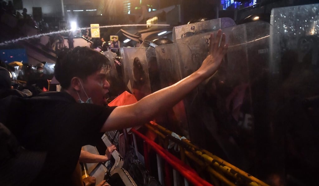 A protester gestures at riot police during an anti-government rally in Bangkok. Photo: AFP A protester gestures at riot police during an anti-government rally in Bangkok. Photo: AFP
