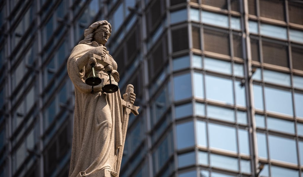 A statue of Lady Justice sits on top of the Court of Final Appeal in Central district, Hong Kong, China. Photo: EPA-EFE