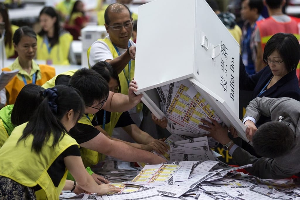 Officials empty ballot papers at the last Legco elections in 2016. Photo: Bloomberg