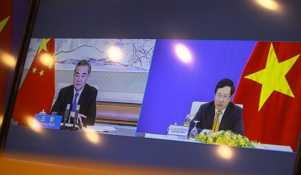 A television screen shows Chinese Foreign Minister Wang Yi and his Vietnamese counterpart Pham Binh Minh in Hanoi. Photo: AP A television screen shows Chinese Foreign Minister Wang Yi and his Vietnamese counterpart Pham Binh Minh in Hanoi. Photo: AP