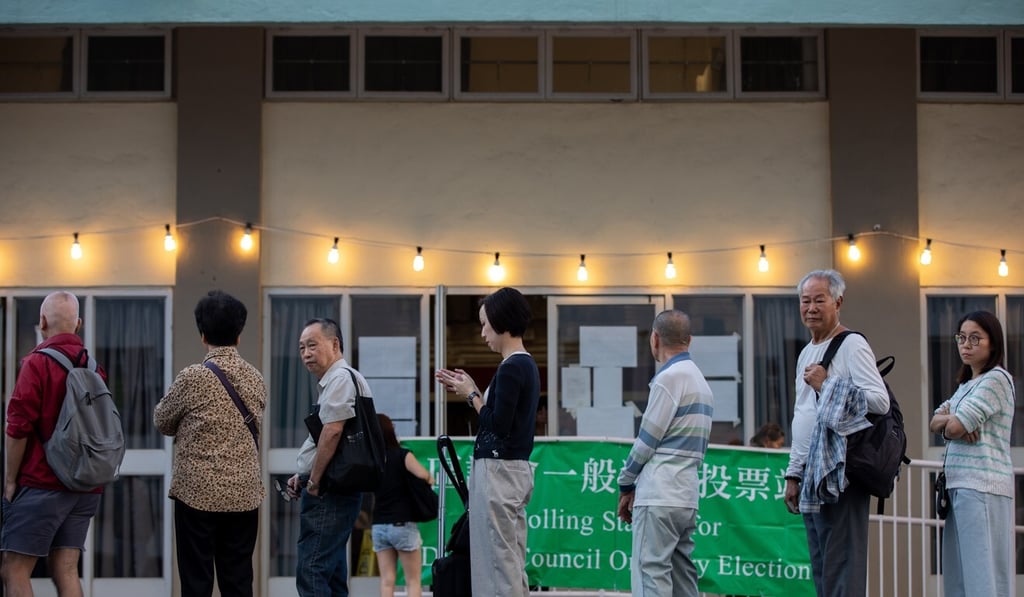 Residents queue up to cast their vote in last year’s district council elections. Photo: EPA-EFE
