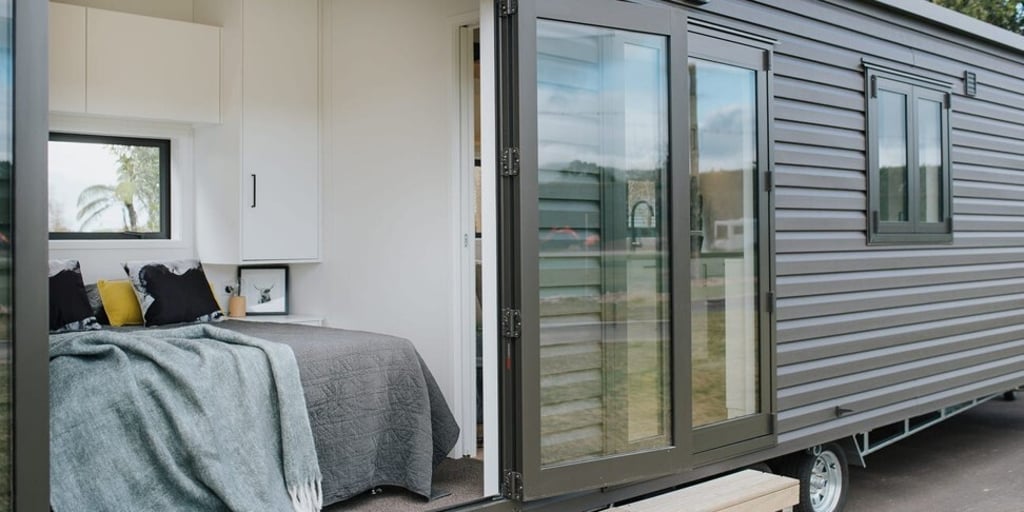 A glimpse into the bedroom in the Dark Horse tiny home. Photo: Build Tiny