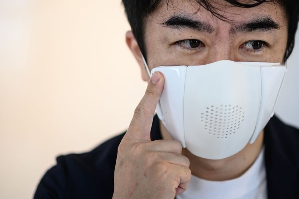 Start-up Donut Robotics has created a face covering that helps users adhere to social distancing and also acts as a translator. Photo: AFP