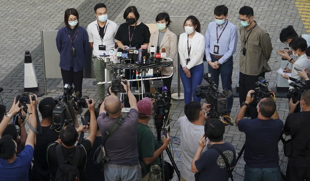 Members of the Hong Kong Dragon Airlines Flight Attendants Association speak to the media outside Cathay Pacific City on Wednesday. Photo: Felix Wong