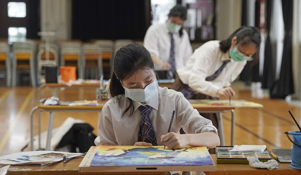 Students wearing masks take a mock exam. Teachers may not be motivated to impart sex education under Hong Kong’s exam-oriented education system. Photo: AP