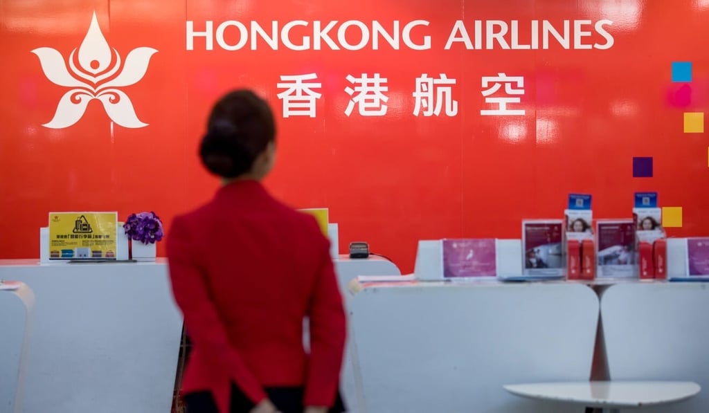 Signage for Hong Kong Airlines at the departure hall of the airport. Photo: Bloomberg