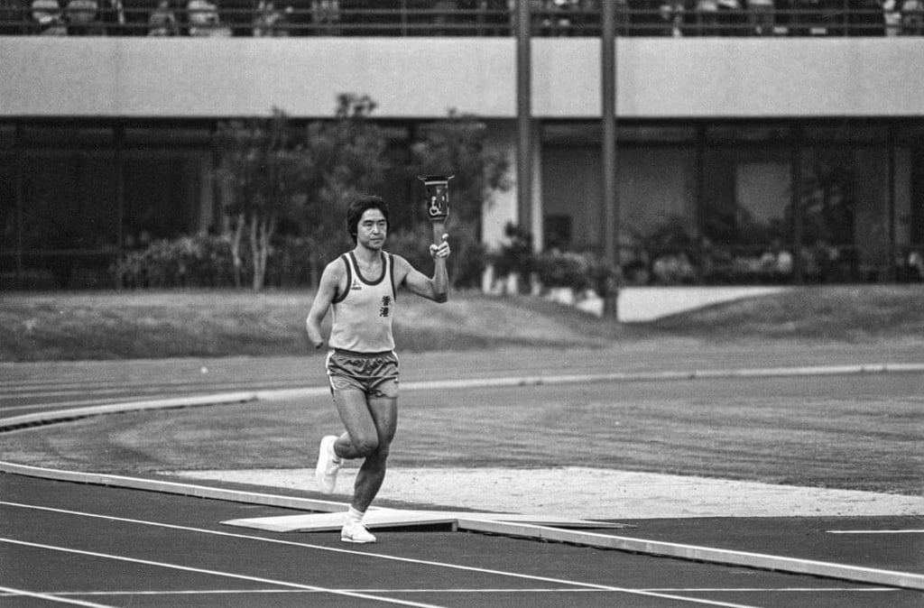 A runner brings the sacred flame into the newly opened Jubilee Sports Centre to start the Far East and South Pacific Games for the Disabled, in 1982. Photo: SCMP