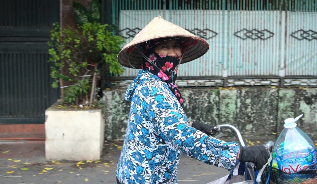 Luong Thi Huyen heads out on her bicycle to collect recyclables in Hanoi. Photo: Sen Nguyen Luong Thi Huyen heads out on her bicycle to collect recyclables in Hanoi. Photo: Sen Nguyen