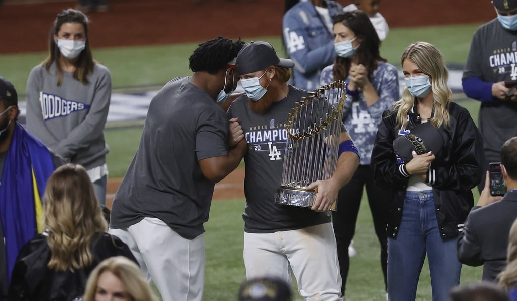 Justin Turner, who was removed during the game after a positive Covid-19 test, celebrates on field after the Dodgers clinched the World Series. Photo: EPA Justin Turner, who was removed during the game after a positive Covid-19 test, celebrates on field after the Dodgers clinched the World Series. Photo: EPA