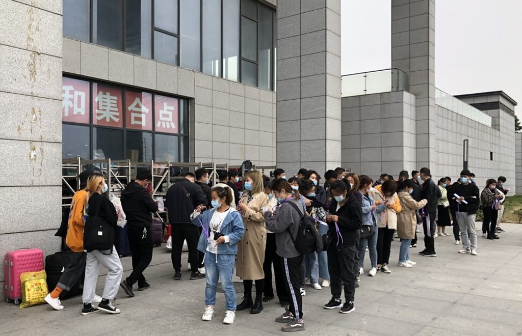 Jobseekers line up outside the world’s largest iPhone manufacturing facility, in Zhengzhou, Henan province. Photo: Orange Wang