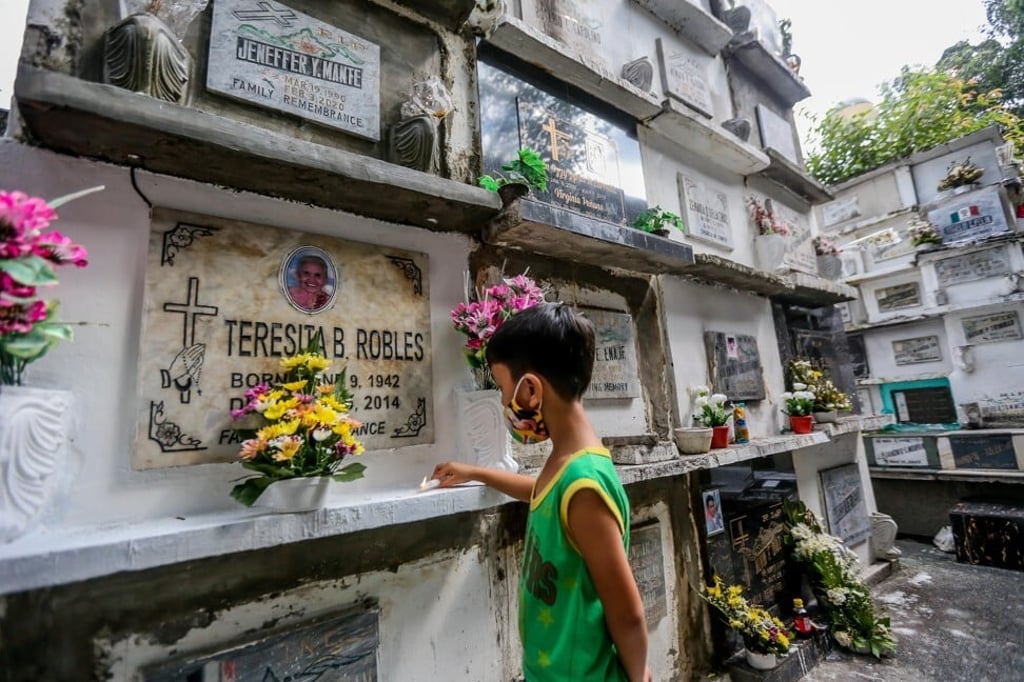 A boy visits a cemetery in Manila on October 28, 2020. Photo: Xinhua