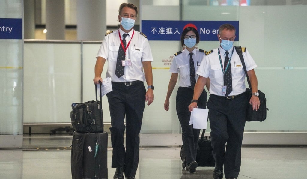 Cathay pilots arriving at Hong Kong’s airport. Photo: Winson Wong Cathay pilots arriving at Hong Kong’s airport. Photo: Winson Wong