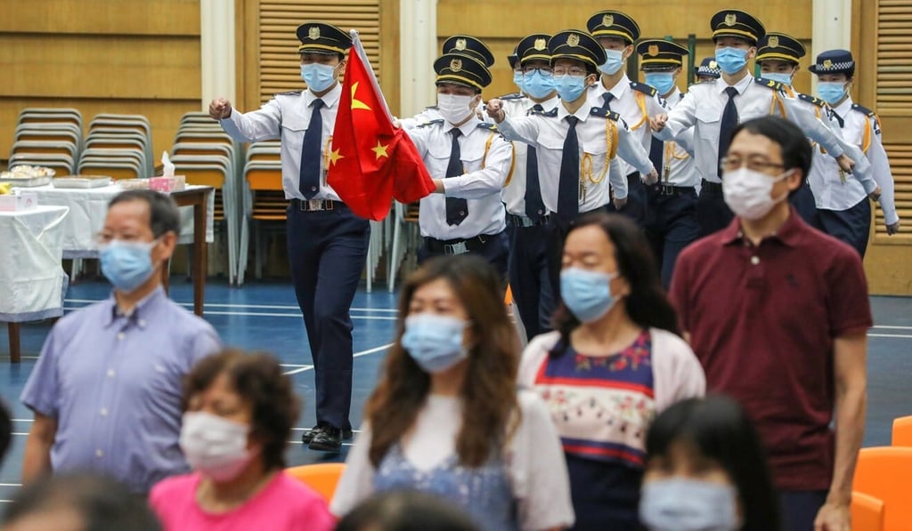 A flag-raising ceremony at Scientia Secondary School in Ho Man Tin on July 1. Photo: May Tse