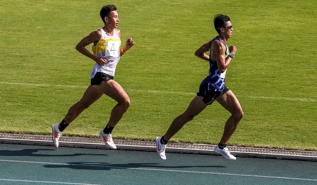 Chan Ka-ho (front) and Wong Kin-chun in the men’s 5,000 metre at the HKAAA trials at Tseung Kwan O Sports Ground, the first domestic meet in which the top two finishers both came in under 15 minutes. Wong won in 14 minutes and 56.65 seconds while Chan clocked 14:58.21. Photo: Jonathan Wong